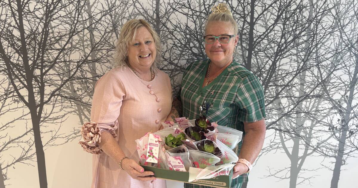 Cancer survivor Leonie Robson and an oncology staff member with a handful of the succulent goody bags Leonie delivered to the oncology unit at Manning Base Hospital. Picture by Julia Driscoll.